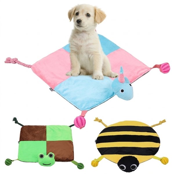 Small dog resting on a interactive dog toy mat